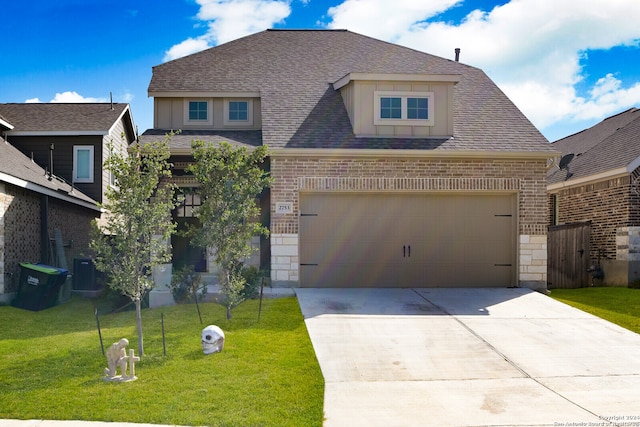 view of front of home with central AC unit, a garage, and a front yard