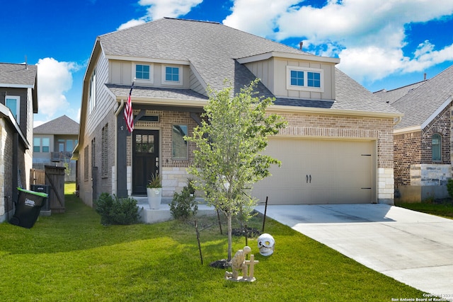 view of front of house with a garage and a front yard