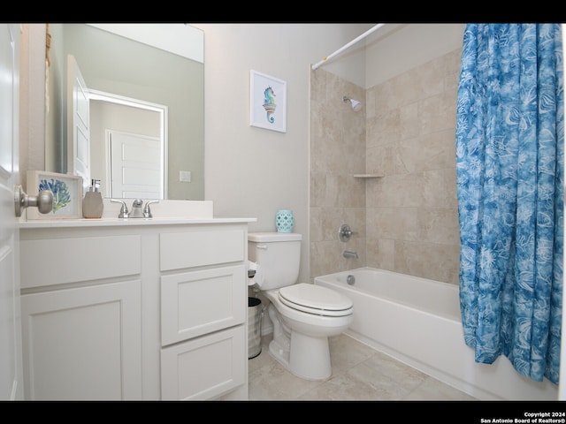 full bathroom with shower / bath combo, vanity, tile patterned floors, and toilet