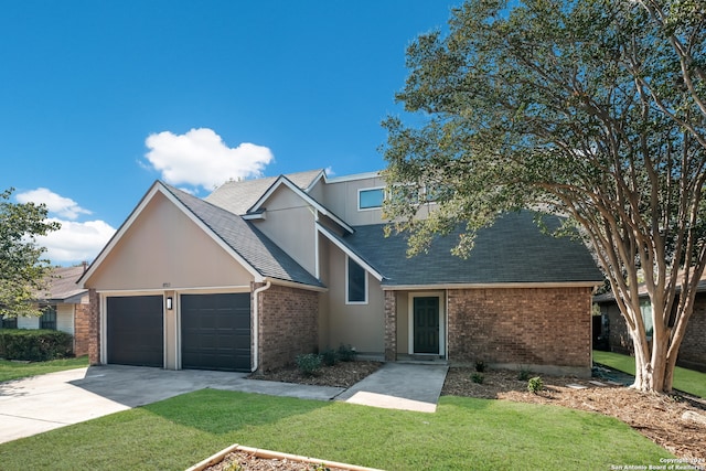 view of front of home with a garage and a front yard