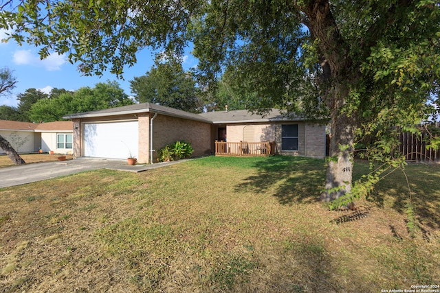 ranch-style home featuring a garage and a front lawn