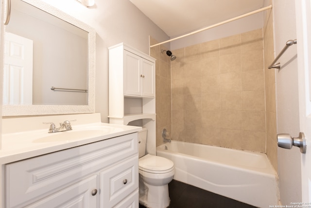 full bathroom featuring vanity, toilet, and tiled shower / bath