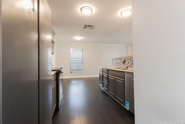 13618 Primwood St, San Antonio, TX 78233 - kitchen with a sink, stainless steel appliances, crown molding, light countertops, and backsplash