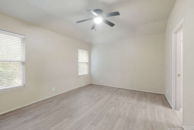 spare room featuring ceiling fan and light hardwood / wood-style flooring