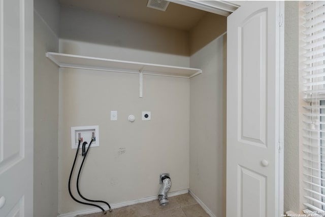 laundry area with gas dryer hookup, washer hookup, light tile patterned flooring, and hookup for an electric dryer