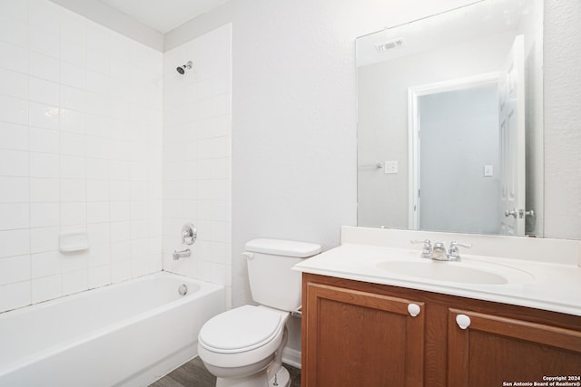 full bathroom featuring vanity, toilet, and tiled shower / bath combo