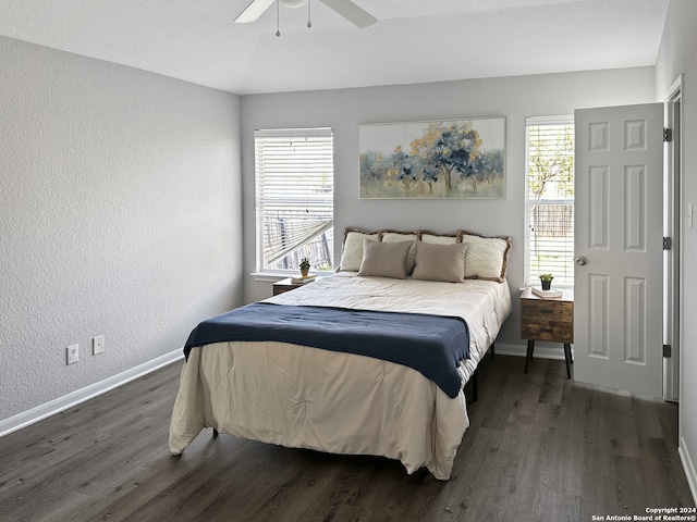 bedroom featuring ceiling fan and dark hardwood / wood-style floors