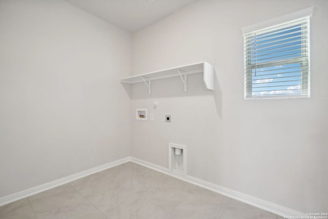 laundry area featuring hookup for an electric dryer, hookup for a washing machine, and hookup for a gas dryer