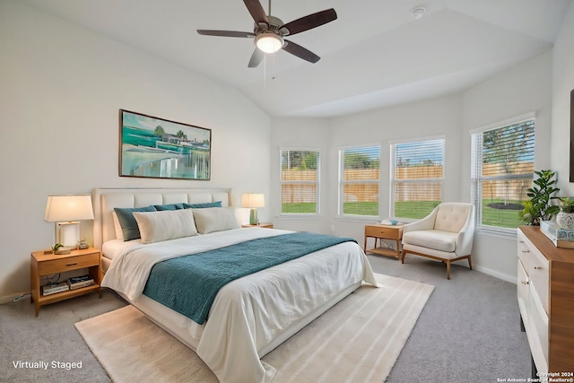 bedroom featuring ceiling fan, light carpet, and lofted ceiling