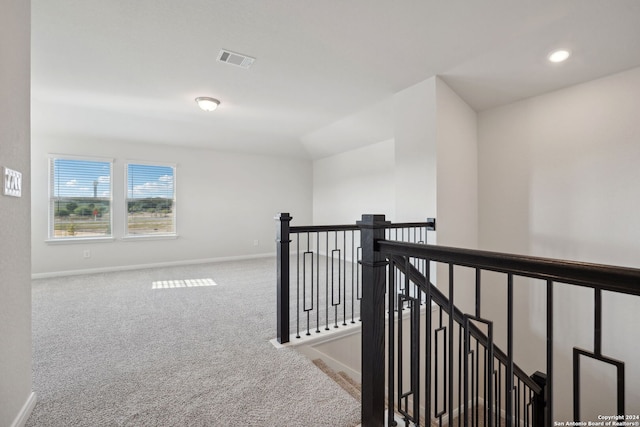 hallway featuring carpet