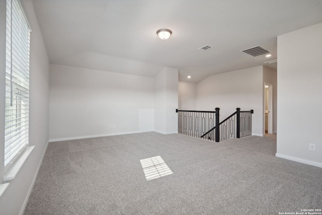 carpeted empty room featuring a healthy amount of sunlight