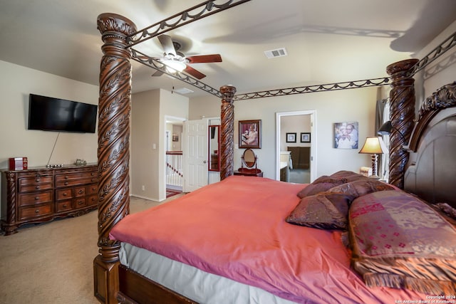 carpeted bedroom featuring ensuite bath and ceiling fan