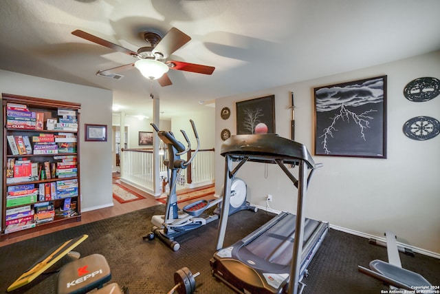 exercise area with hardwood / wood-style flooring and ceiling fan