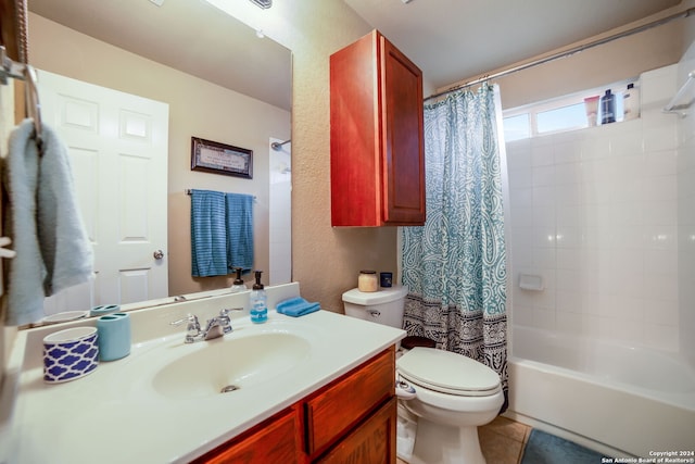 full bathroom featuring shower / bath combo with shower curtain, tile patterned flooring, vanity, and toilet