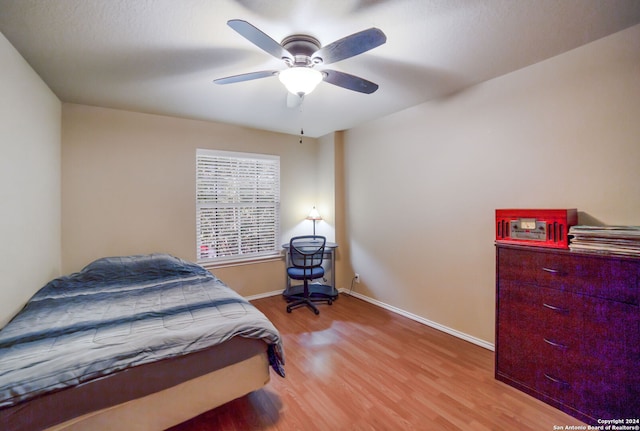 bedroom with hardwood / wood-style flooring and ceiling fan