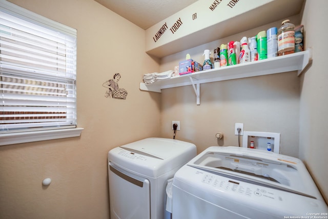 washroom featuring a healthy amount of sunlight and washer and dryer