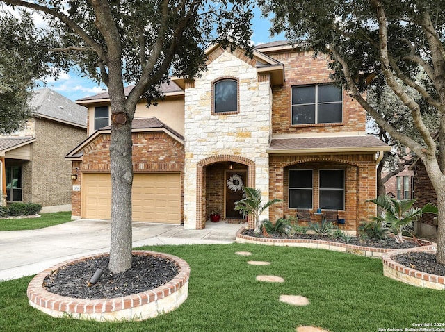 view of front of home featuring a garage and a front lawn