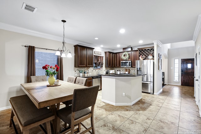 interior space with ornamental molding and an inviting chandelier