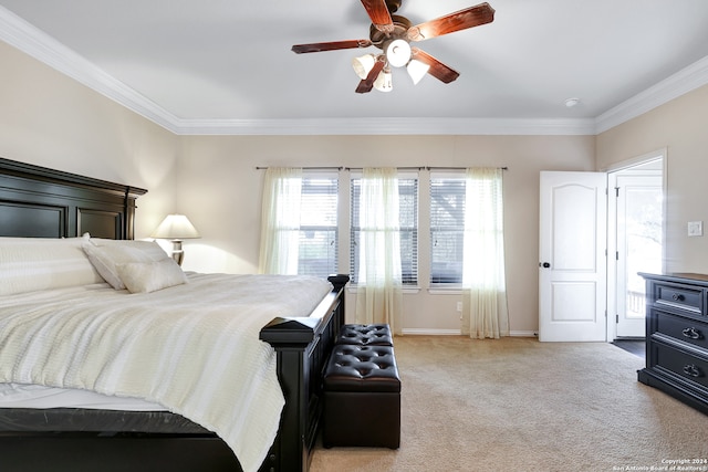 bedroom with carpet flooring, ceiling fan, and crown molding