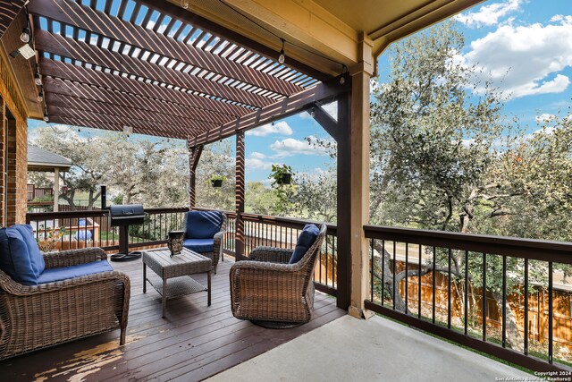 wooden terrace featuring outdoor lounge area and a pergola