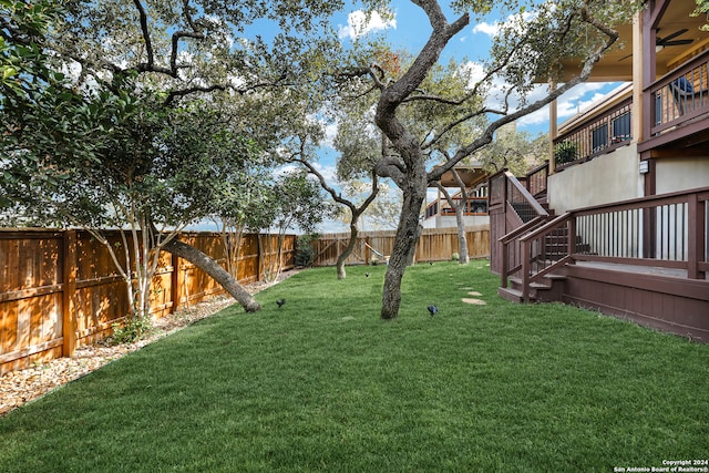 view of yard with a wooden deck