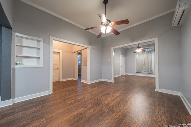 empty room with built in shelves, a wall mounted AC, crown molding, dark hardwood / wood-style floors, and ceiling fan