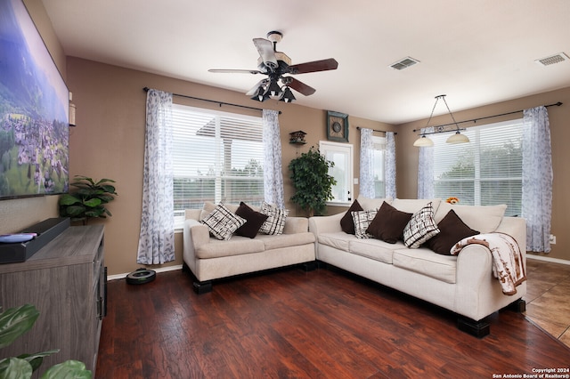 living room with ceiling fan and dark hardwood / wood-style floors