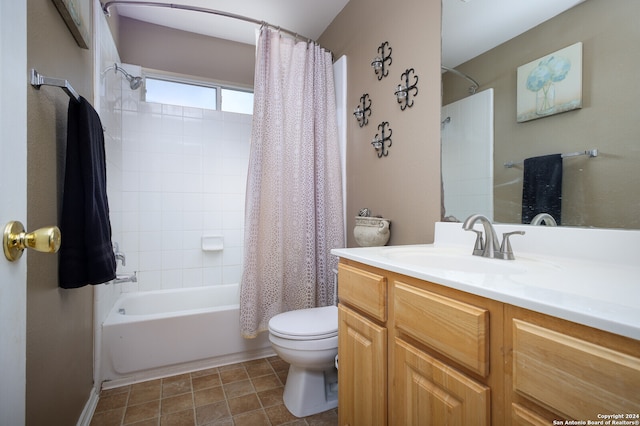 full bathroom featuring shower / bath combo, toilet, and vanity