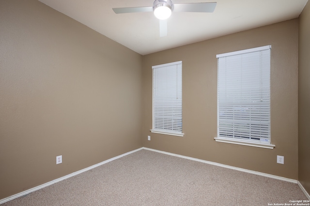 carpeted empty room with ceiling fan