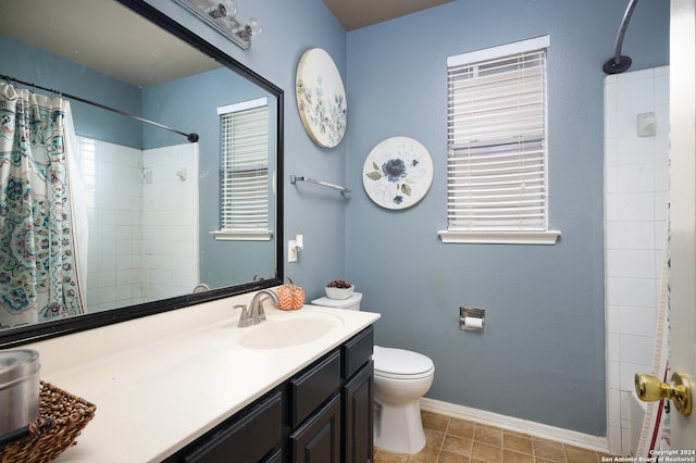 bathroom featuring a shower with curtain, vanity, toilet, and tile patterned flooring