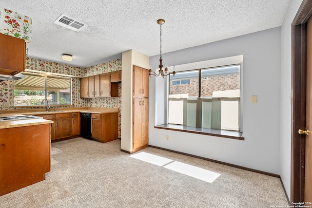 kitchen featuring black dishwasher, a notable chandelier, a textured ceiling, sink, and pendant lighting