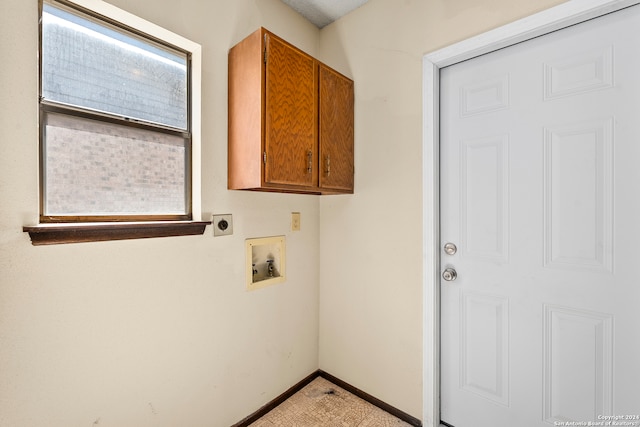 laundry area with washer hookup, cabinets, and electric dryer hookup