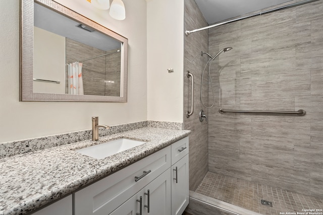 bathroom featuring vanity and a shower with curtain