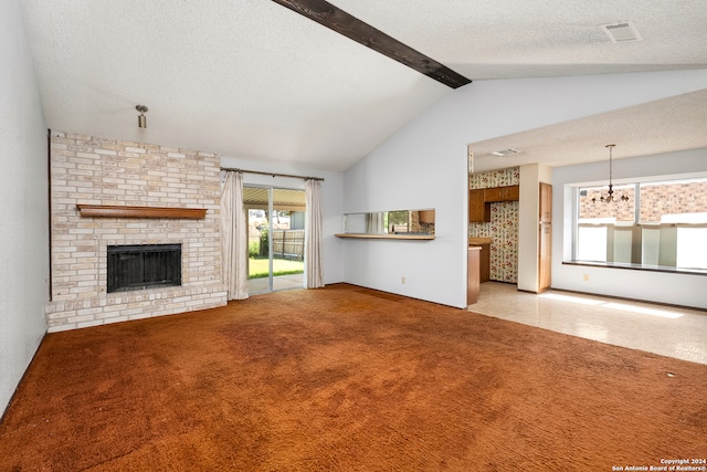 unfurnished living room featuring vaulted ceiling with beams, a textured ceiling, a notable chandelier, a brick fireplace, and light colored carpet