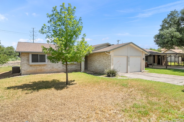 single story home featuring central AC unit, a garage, and a front yard