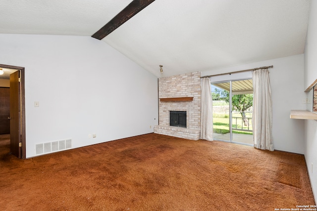 unfurnished living room with a fireplace, lofted ceiling with beams, and carpet