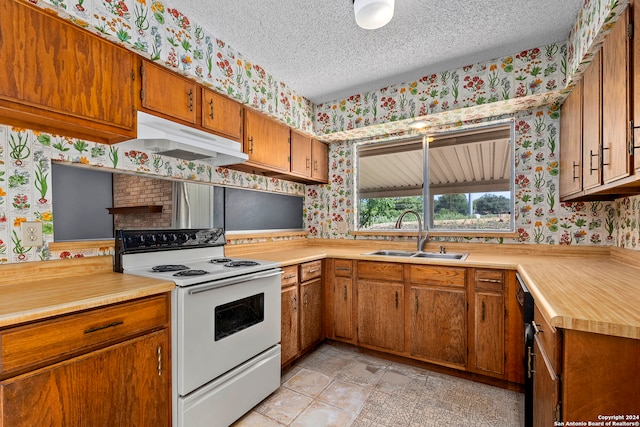 kitchen featuring white range with electric cooktop, a textured ceiling, light tile patterned floors, sink, and a brick fireplace