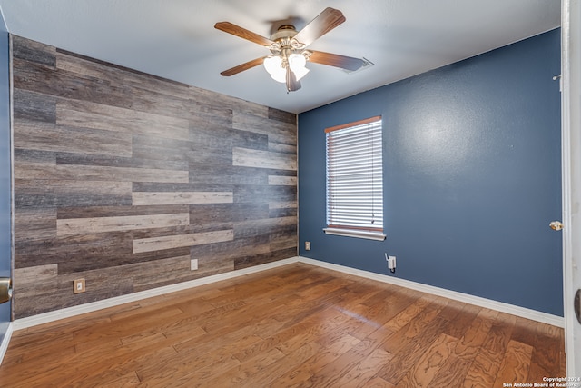 unfurnished room featuring hardwood / wood-style flooring and ceiling fan