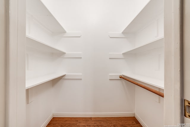 walk in closet featuring hardwood / wood-style flooring