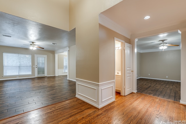 unfurnished room featuring ceiling fan, ornamental molding, and light hardwood / wood-style flooring