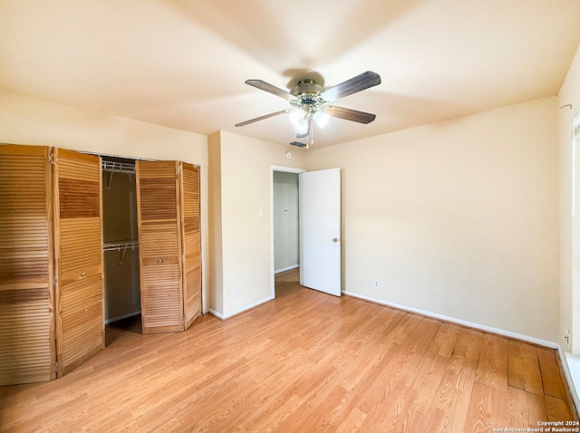 unfurnished bedroom with a closet, light wood-type flooring, and ceiling fan