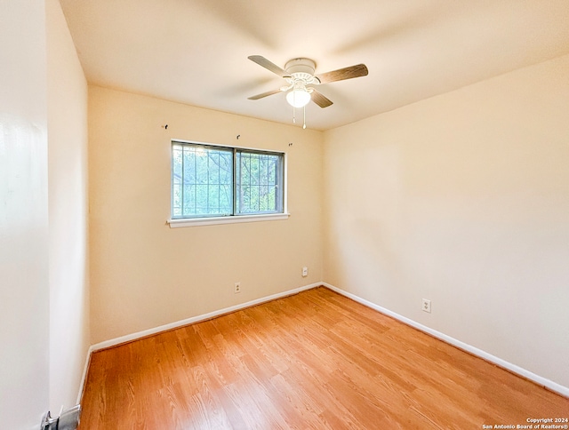 unfurnished room featuring ceiling fan and light hardwood / wood-style floors