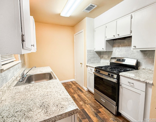 kitchen with white cabinetry, sink, and stainless steel gas stove