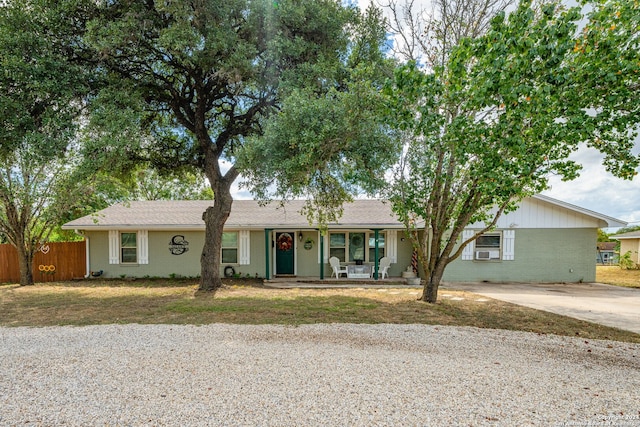 ranch-style house featuring covered porch