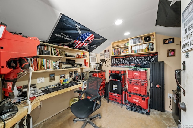 office space with concrete flooring and a workshop area