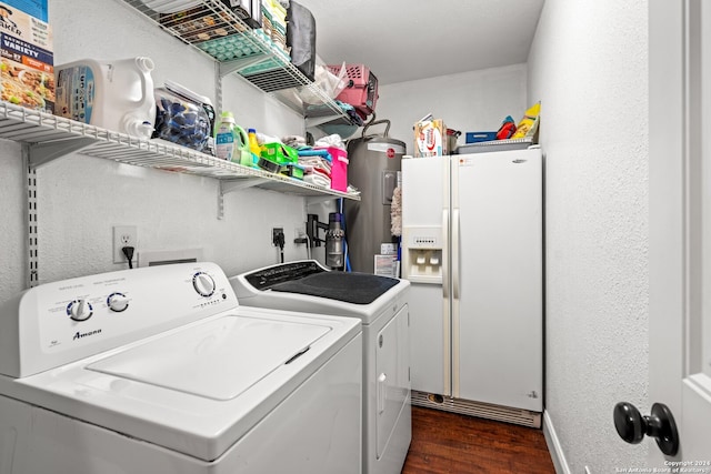 laundry area with washing machine and dryer, water heater, and dark wood-type flooring