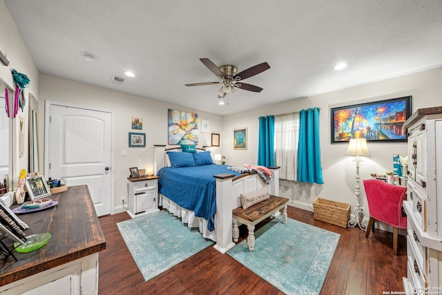 bedroom featuring ceiling fan and dark hardwood / wood-style flooring