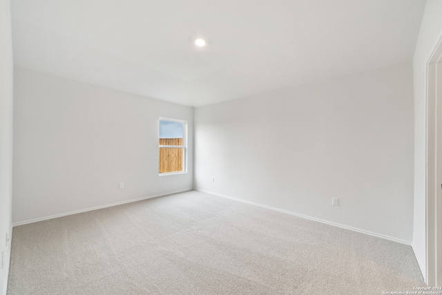 unfurnished room with light colored carpet