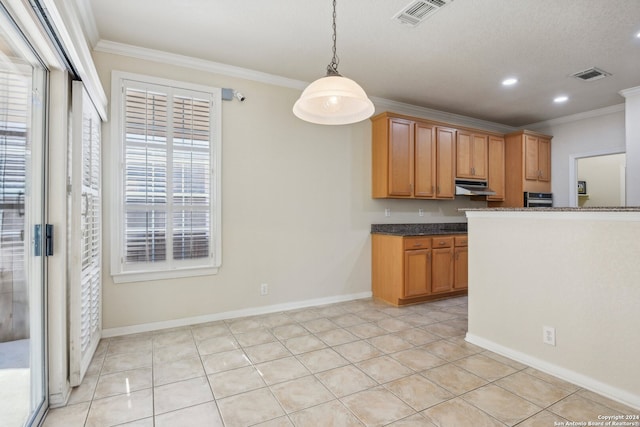 kitchen featuring light tile patterned floors, pendant lighting, and crown molding