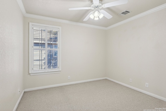 unfurnished room with carpet flooring, ceiling fan, and crown molding